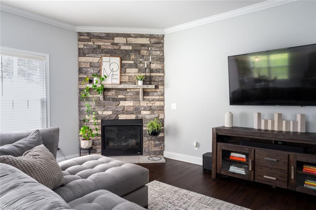166 Windmill Trail High Point, NC 27265 - Photo 3 of 34 Beautiful stone accent gas fireplace for cozy winter nights.