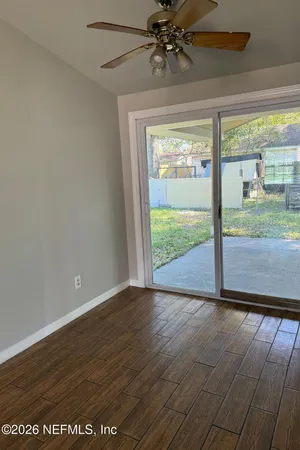 a view of an empty room with a window