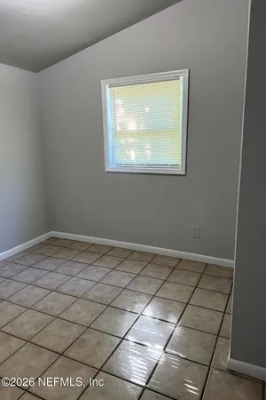 a view of an empty room and window