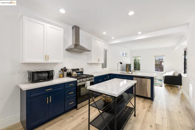 a kitchen with a stove a sink and a refrigerator