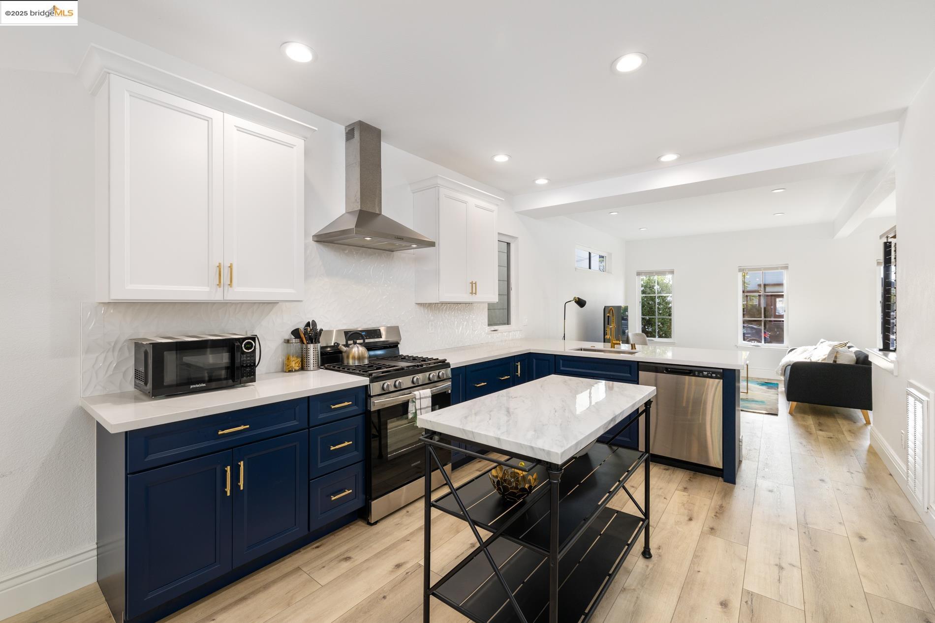 a kitchen with a stove a sink and a refrigerator