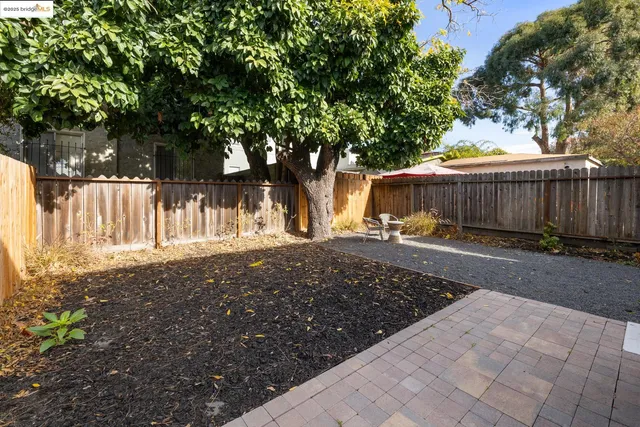 a view of a backyard of the house