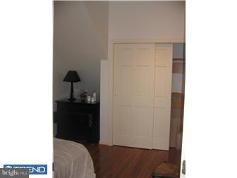 259 North 3rd Street, Unit 3R Philadelphia, PA 19106 - Photo 1 of 1 a living room with a chair and a wooden floor