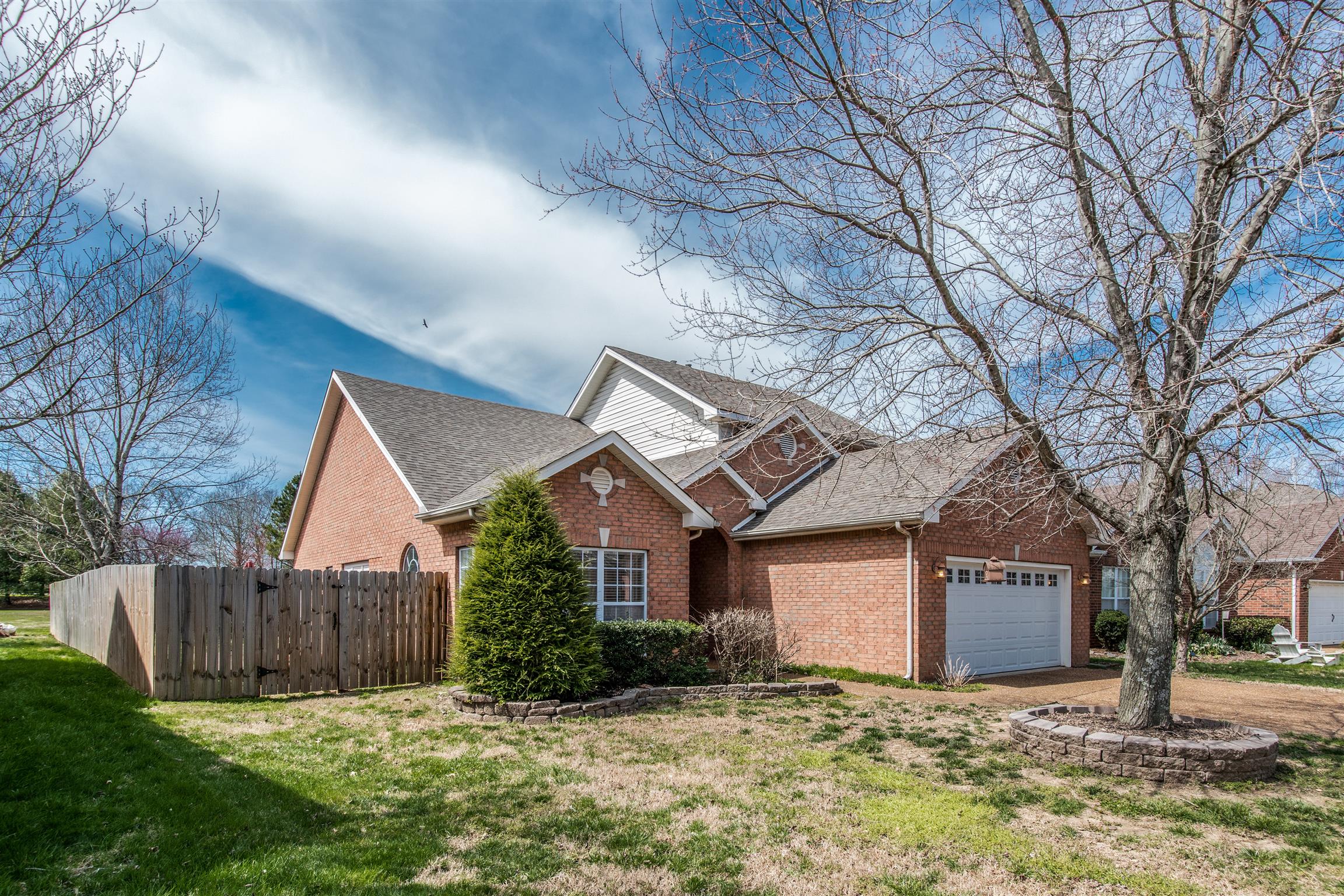 3181 Vera Valley Road Franklin, TN 37064 - Photo 2 of 26 a front view of a house with a yard and garage