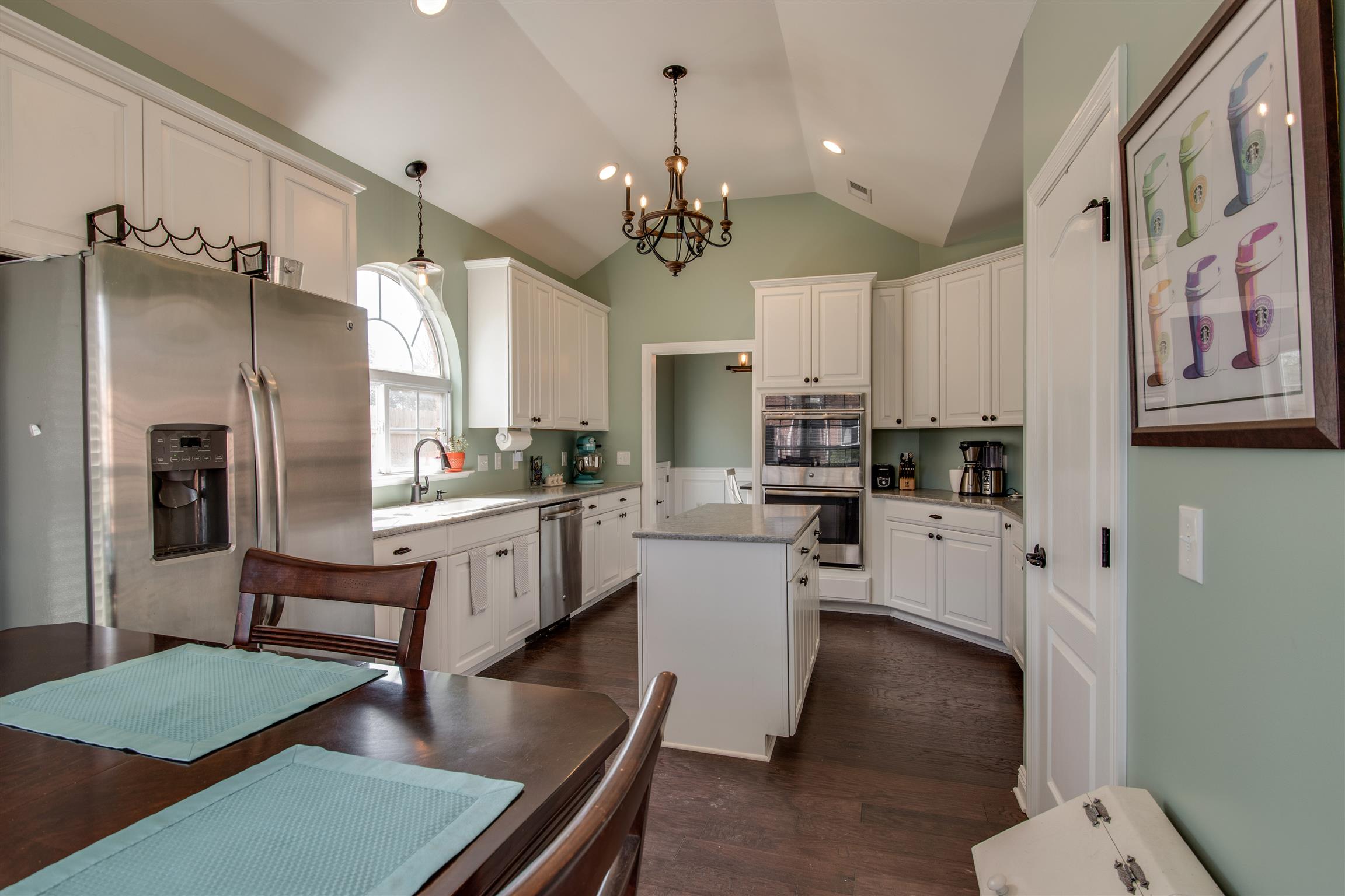 3181 Vera Valley Road Franklin, TN 37064 - Photo 11 of 26 a kitchen with white cabinets and stainless steel appliances