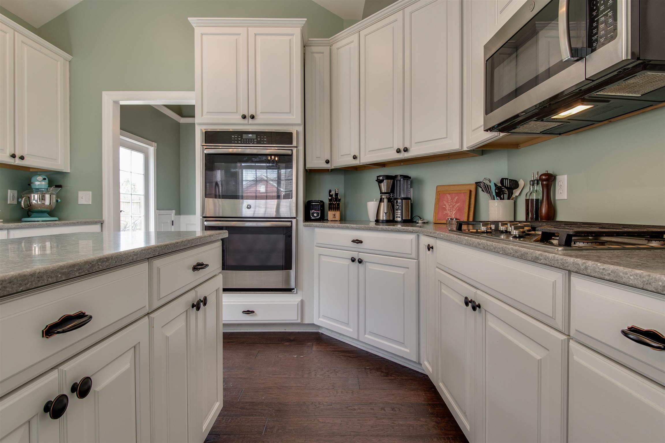 3181 Vera Valley Road Franklin, TN 37064 - Photo 13 of 26 a kitchen with white cabinets and appliances