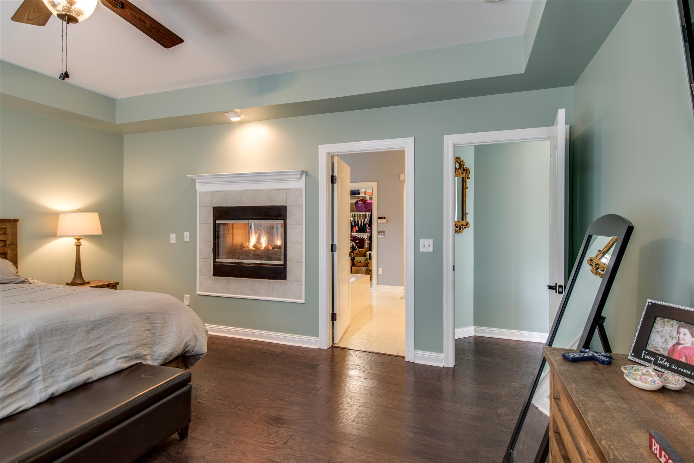 3181 Vera Valley Road Franklin, TN 37064 - Photo 16 of 26 a bedroom with a bed and a flat tv screen on a dresser