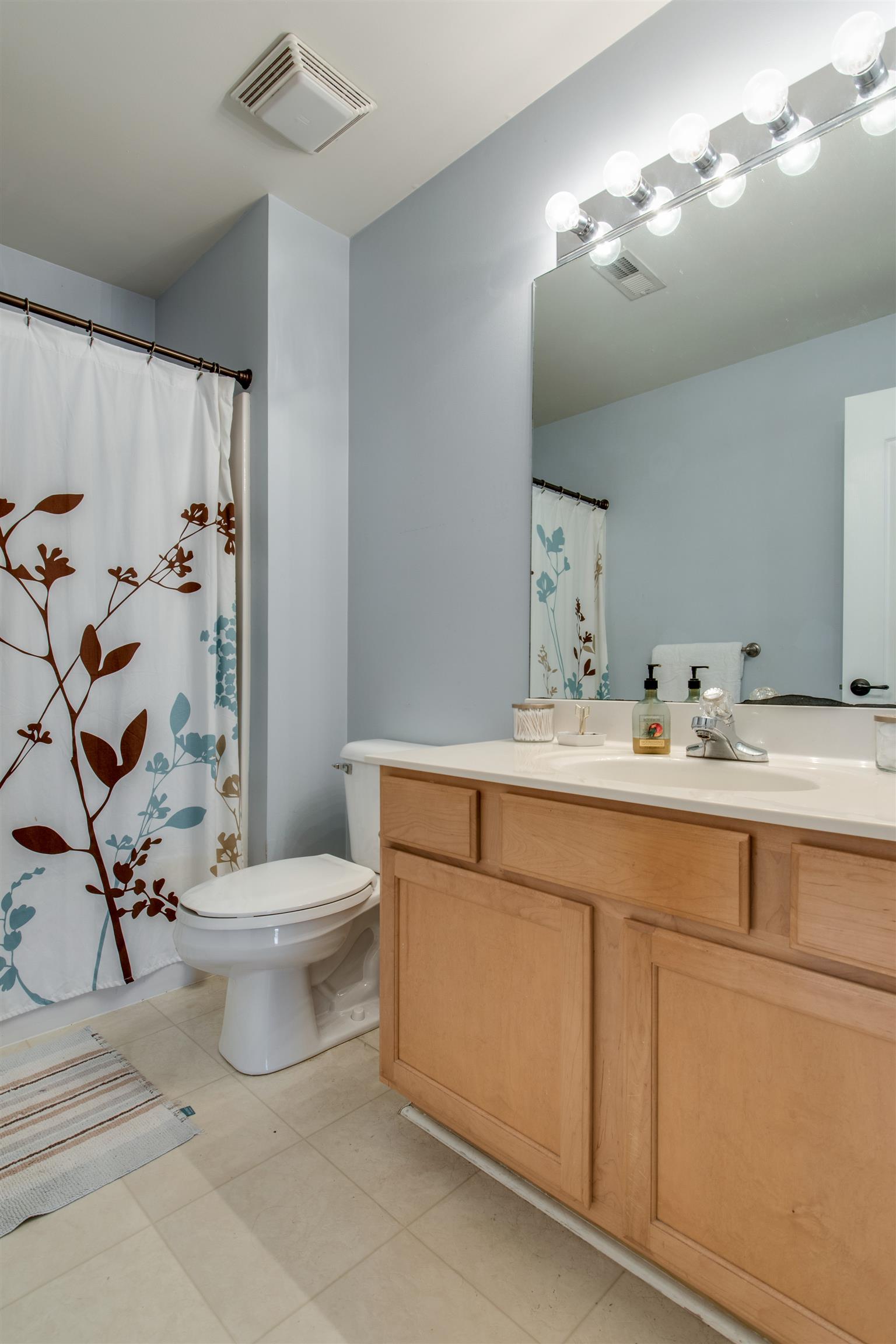 3181 Vera Valley Road Franklin, TN 37064 - Photo 21 of 26 a bathroom with a sink toilet and shower