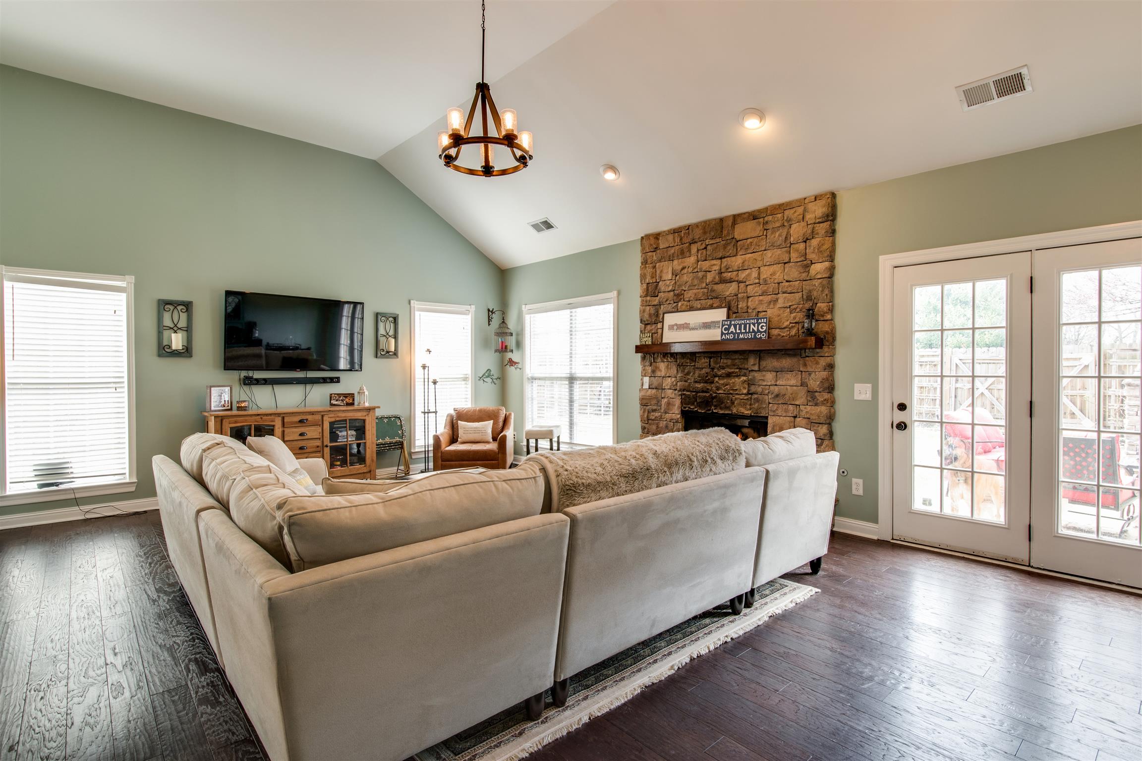 3181 Vera Valley Road Franklin, TN 37064 - Photo 6 of 26 a living room with fireplace furniture and a flat screen tv
