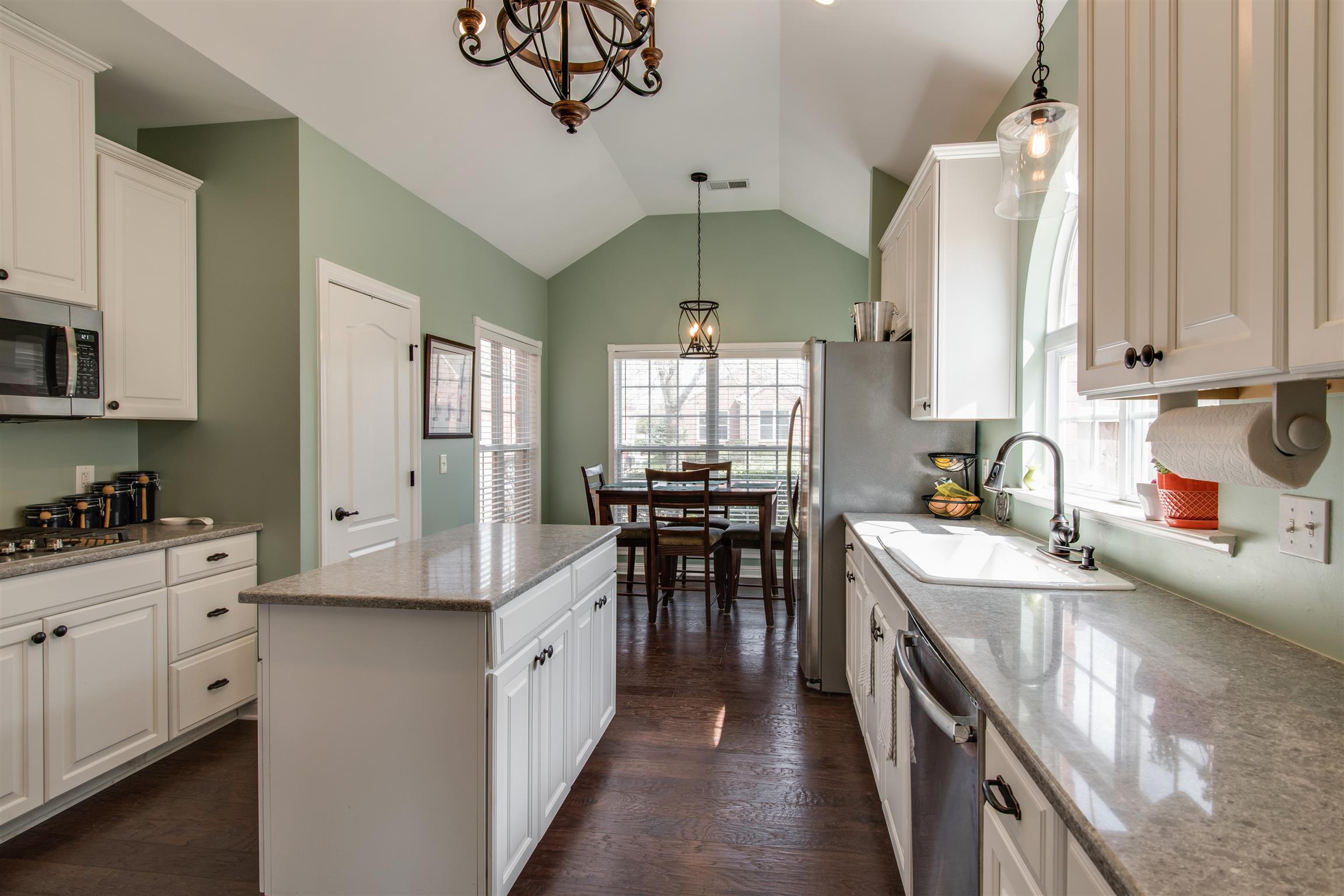 3181 Vera Valley Road Franklin, TN 37064 - Photo 10 of 26 a kitchen with counter top space a sink appliances and cabinets