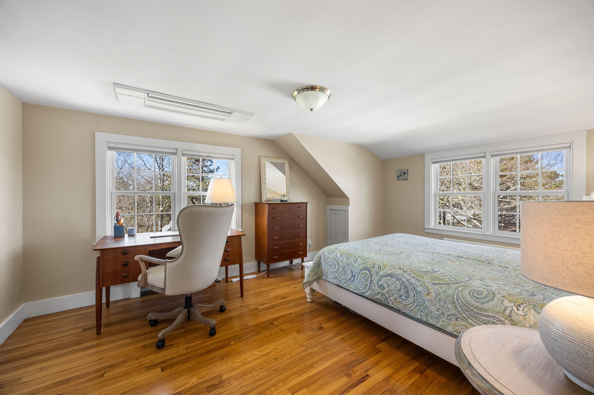 58 Stepping Stones Road Chatham, MA 02633 - Photo 27 of 52 a bedroom with a bed a desk and chair with wooden floor