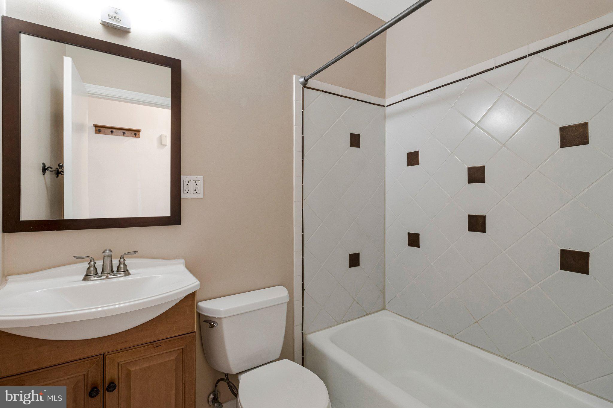 1248 C Street Southeast, Unit A Washington, DC 20003 - Photo 11 of 15 a bathroom with a sink toilet and shower