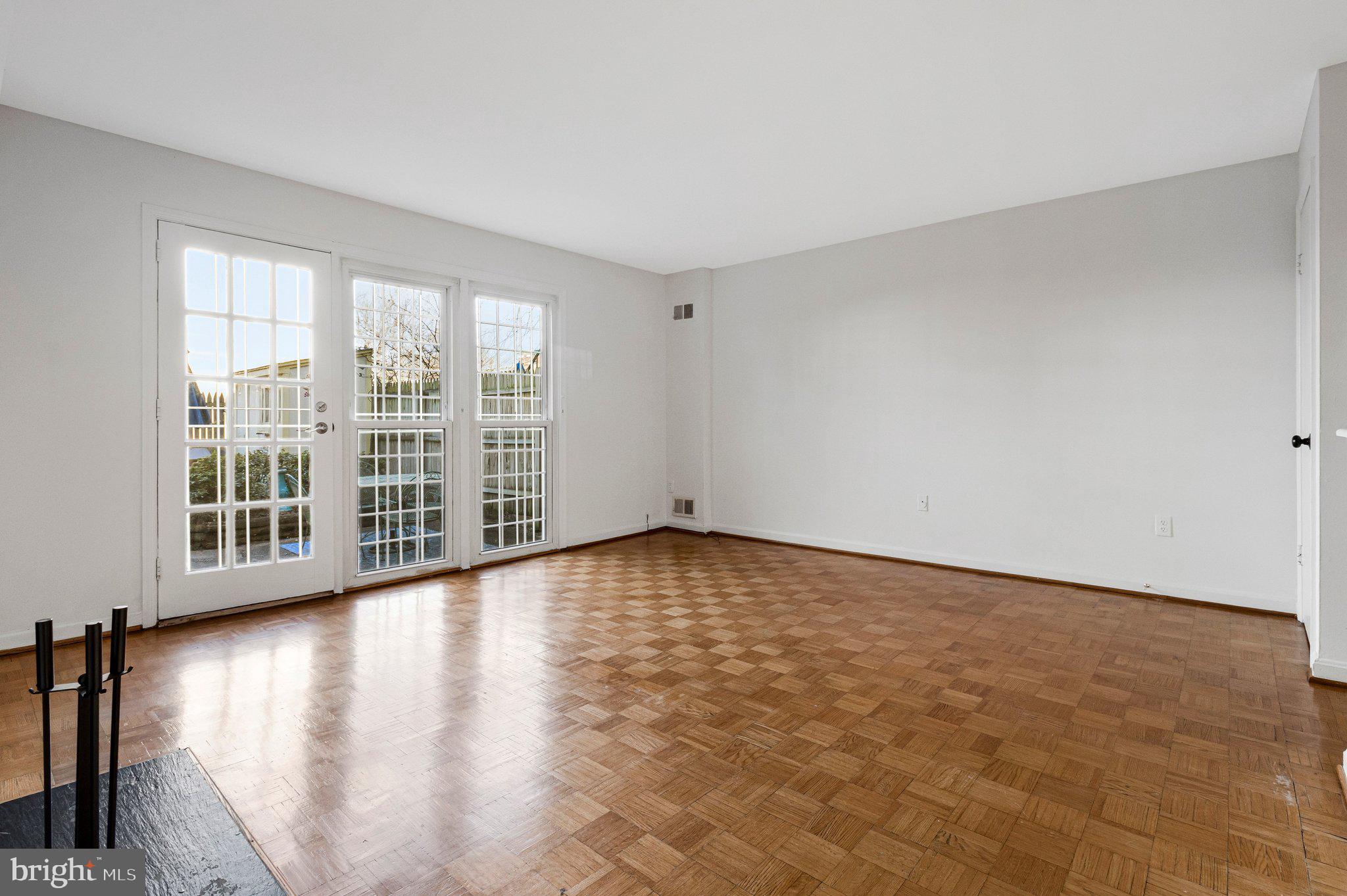 1248 C Street Southeast, Unit A Washington, DC 20003 - Photo 3 of 15 wooden floor in an empty room with a window