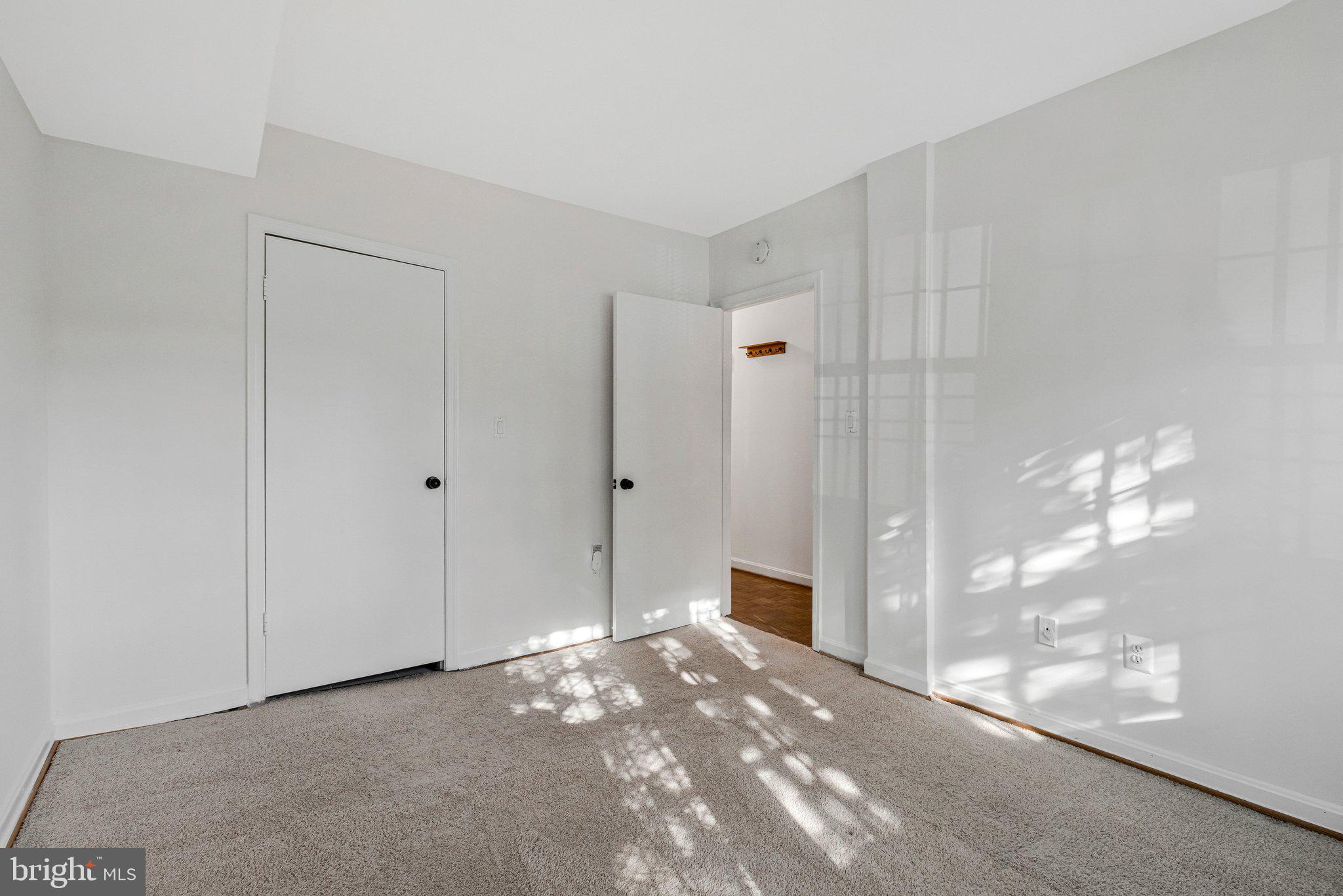 1248 C Street Southeast, Unit A Washington, DC 20003 - Photo 9 of 15 a view of a big room with closet and chandelier fan