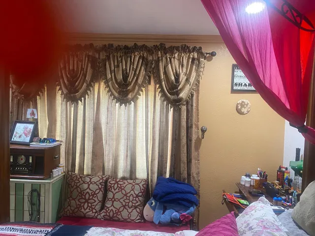 a view of a hallway and dining room