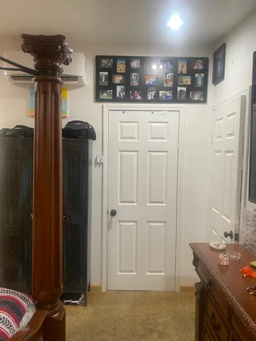 a bedroom with a bed and a couch