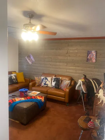 a living room with furniture and a window