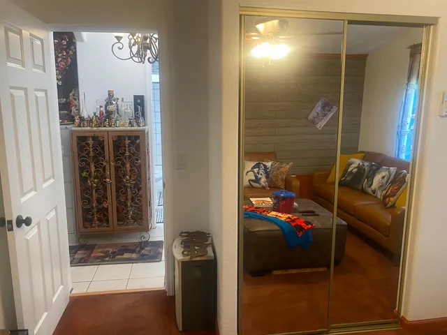 a bathroom with a table and a clock