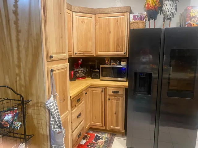 a kitchen with stainless steel appliances a refrigerator and a stove