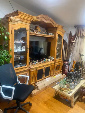 a living room filled with furniture and a flat screen tv