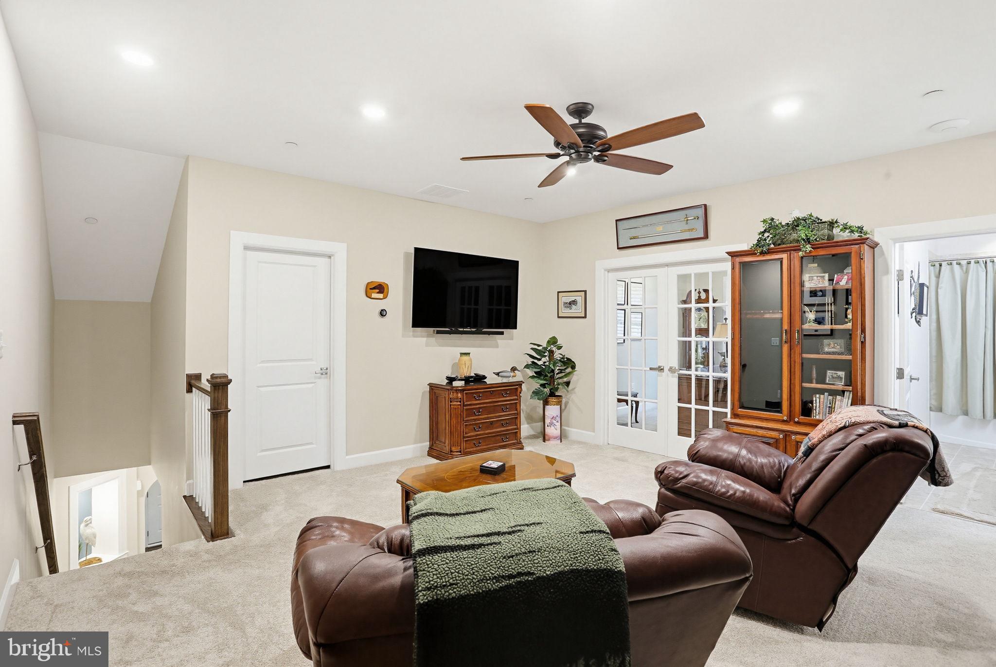 3816 Fulham Road Frederick, MD 21704 - Photo 26 of 77 a living room with furniture and a flat screen tv