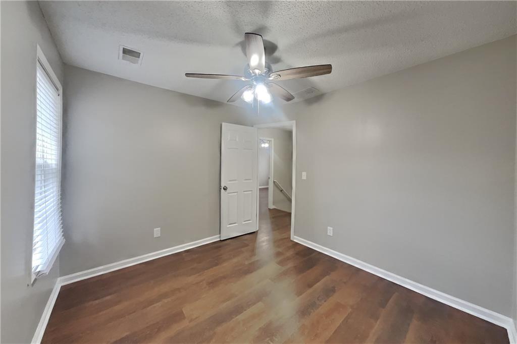 1603 Fort Perry Way Dacula, GA 30019 - Photo 11 of 19 wooden floor in an empty room