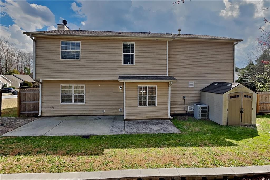 1603 Fort Perry Way Dacula, GA 30019 - Photo 17 of 19 front view of house with a yard