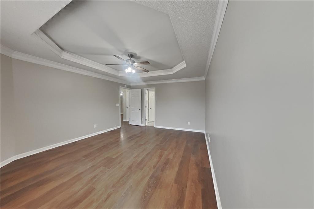 1603 Fort Perry Way Dacula, GA 30019 - Photo 8 of 19 a view of an empty room with wooden floor