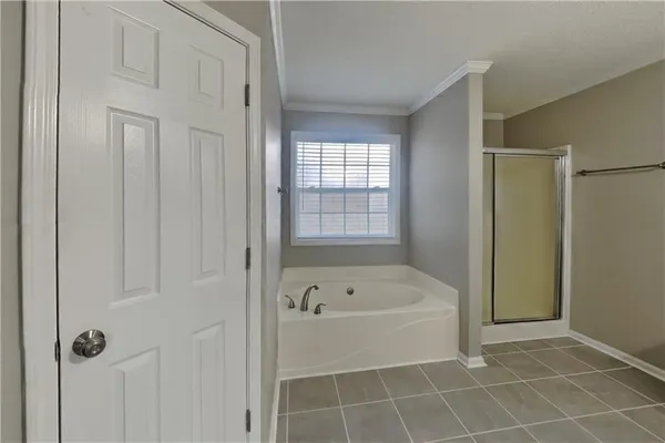 a white bath tub sitting next to a window