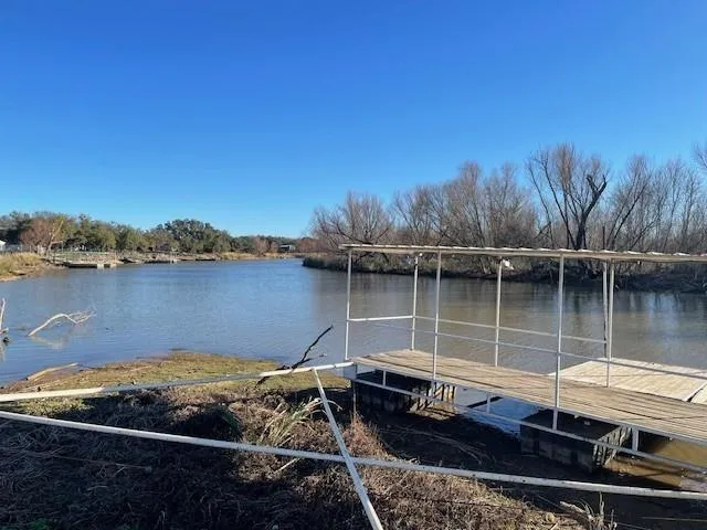 a small pool with a lake view