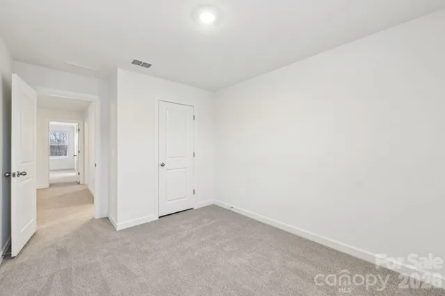 an empty room with a bench