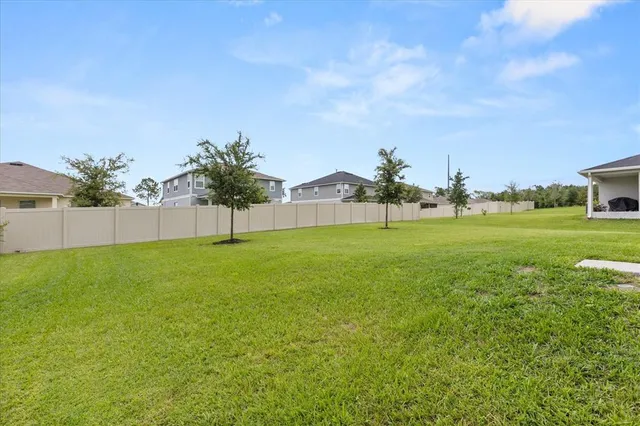a view of a garden with a building in the background