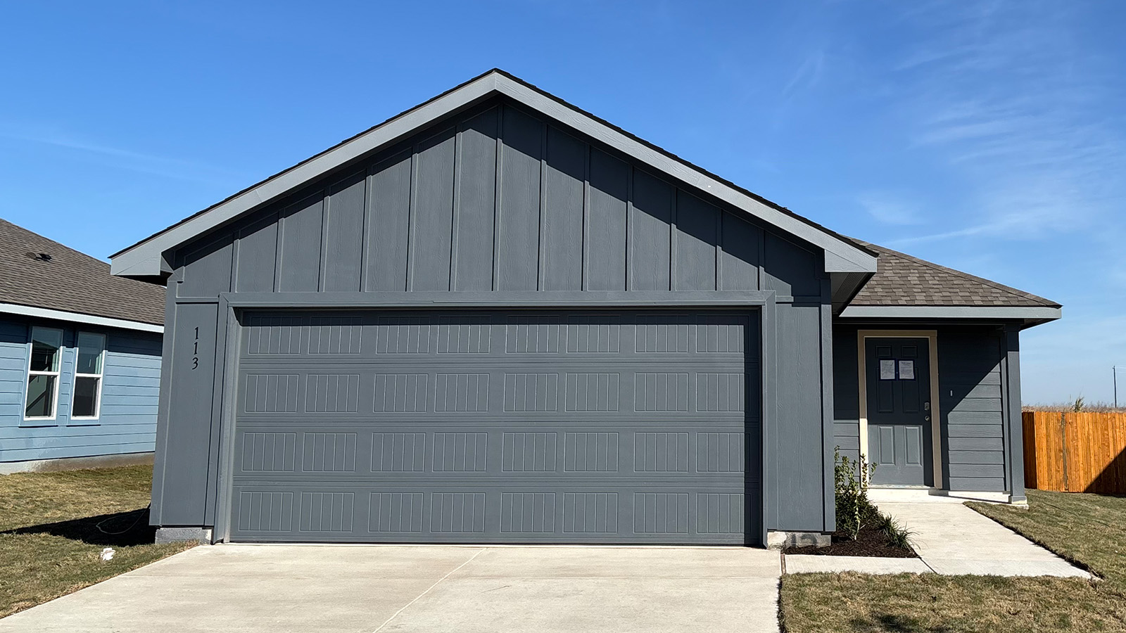a front view of a house with garage