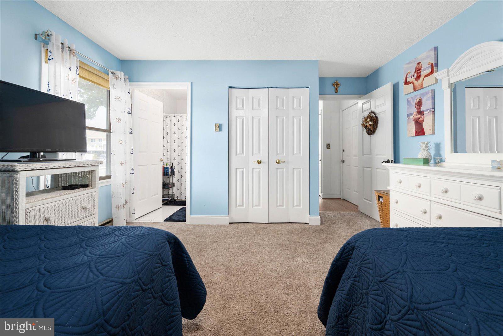 620 Salt Spray Road, Unit 1W Ocean City, MD 21842 - Photo 16 of 27 Primary bedroom with ceiling fan
