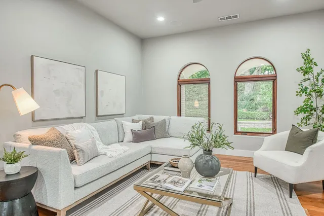a living room with furniture and a large window