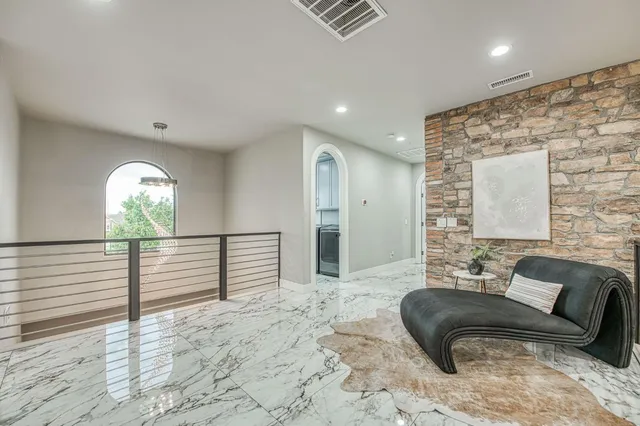 a spacious bedroom with a bed and a couch