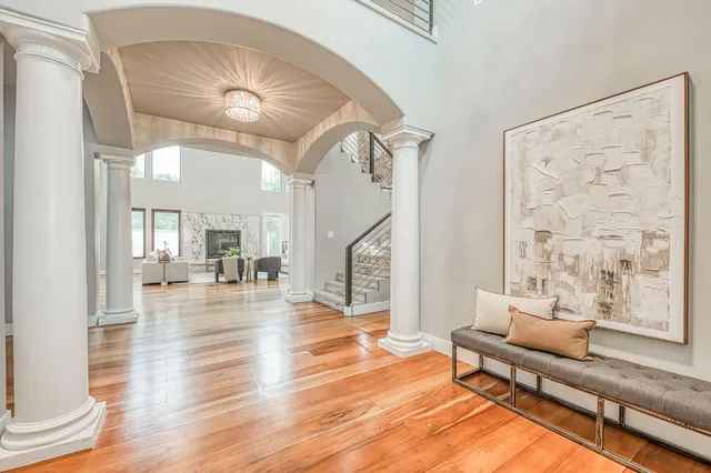 a living room with furniture and wooden floor
