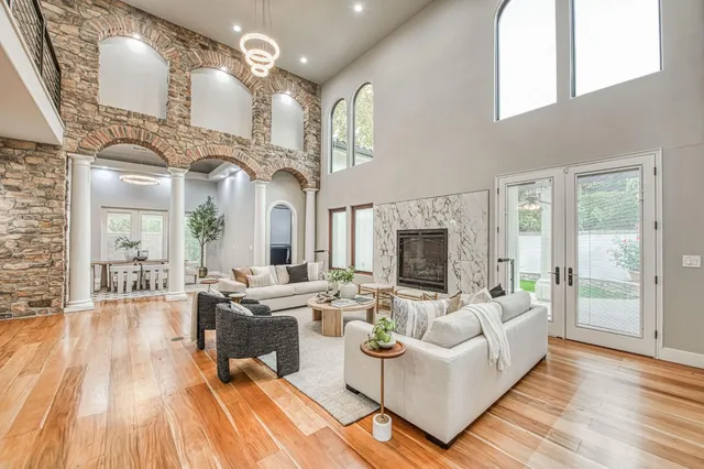 a living room with furniture and a fireplace