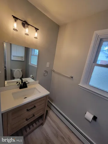 a room with pool table and mirror