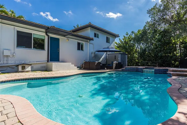 a house view with a swimming pool
