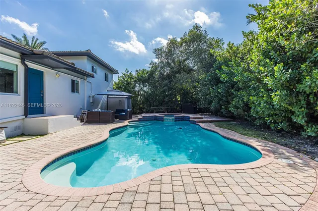a view of a swimming pool with a patio