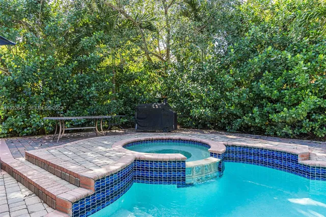 a view of a chairs and table in the patio