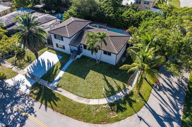 a view of a swimming pool with sitting area