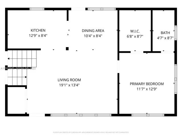 a picture of a bench in front of a wall