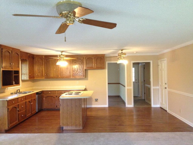 6310 Stapleton Road Macon, GA 31206 - Photo 3 of 15 a large kitchen with stainless steel appliances granite countertop a sink counter space and cabinets