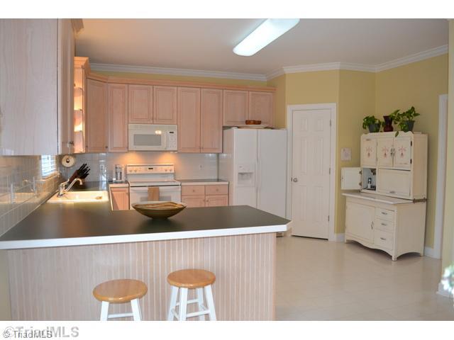3100 Timberwolf Avenue High Point, NC 27265 - Photo 7 of 16 Kitchen. The kitchen is so spacious! Notice the pantry and abundant cabinet/counter space!