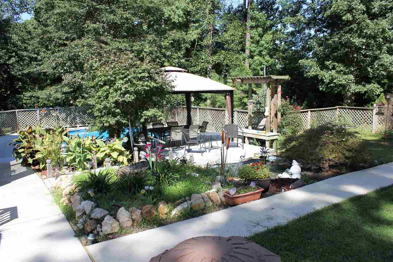 9504 Springdale Drive Raleigh, NC 27613 - Photo 21 of 25 Backyard Oasis w/Water Feature