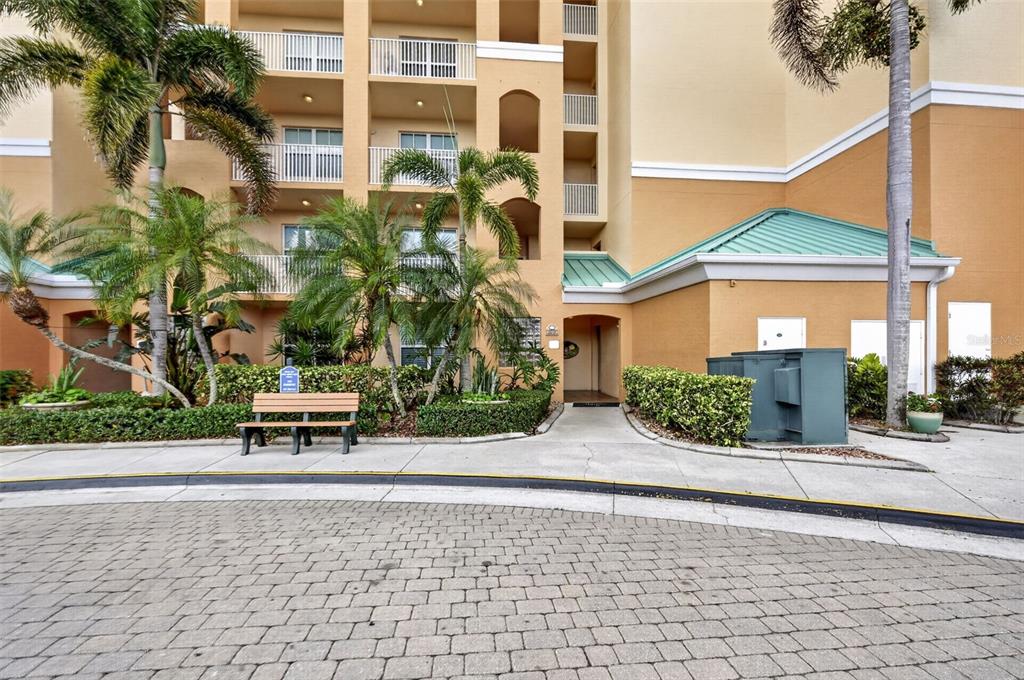 2060 Matecumbe Key Road, Unit 2506 Punta Gorda, FL 33955 - Photo 34 of 38 a house with a bench in front of it