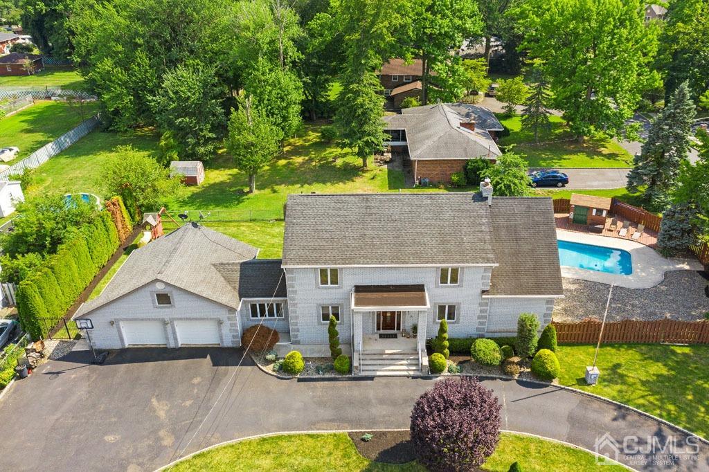 713 New Dover Road Edison, NJ 08820 - Photo 1 of 46 an aerial view of a house with a yard and a large tree