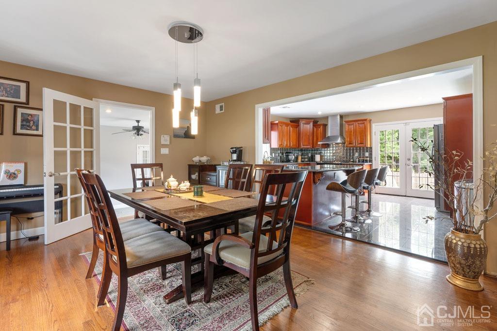 713 New Dover Road Edison, NJ 08820 - Photo 16 of 46 a view of a dining room with furniture window and wooden floor